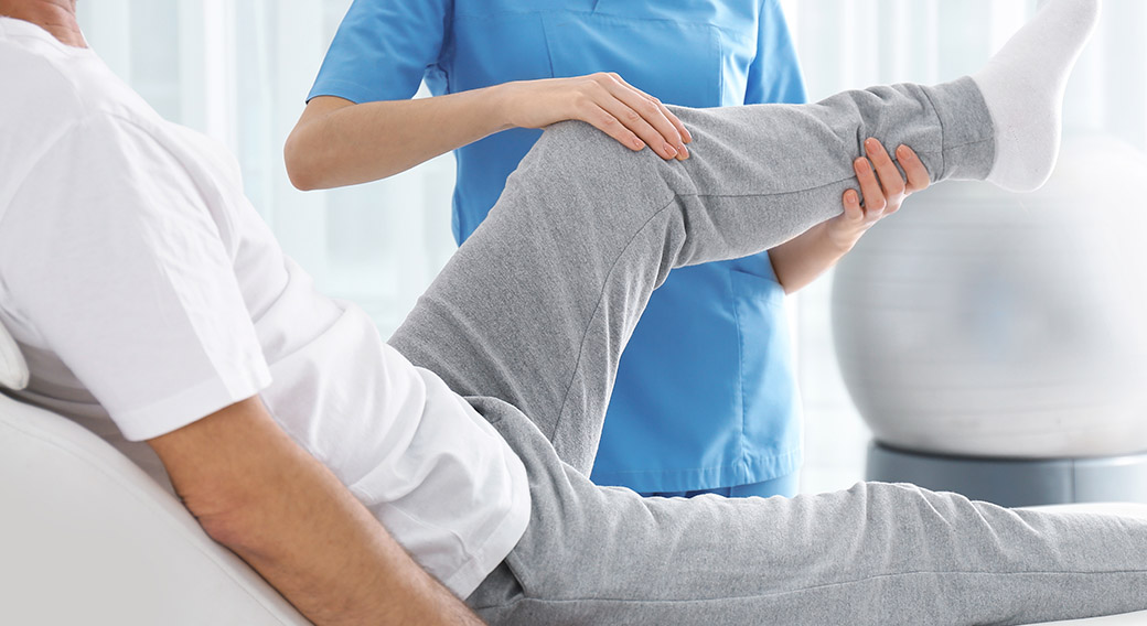 Image of patient having knee therapy